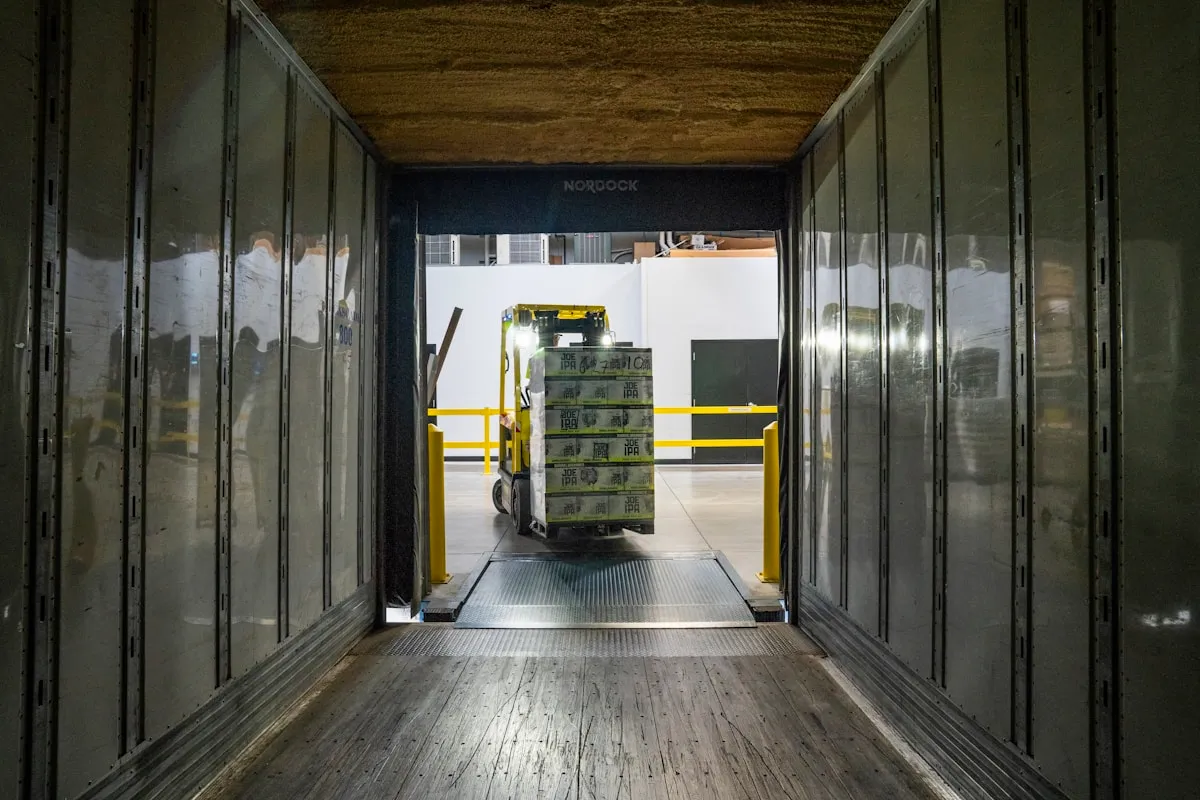 A forklift operating in daylight at a logistics facility — professional handling is essential when moving valuable gold shipments