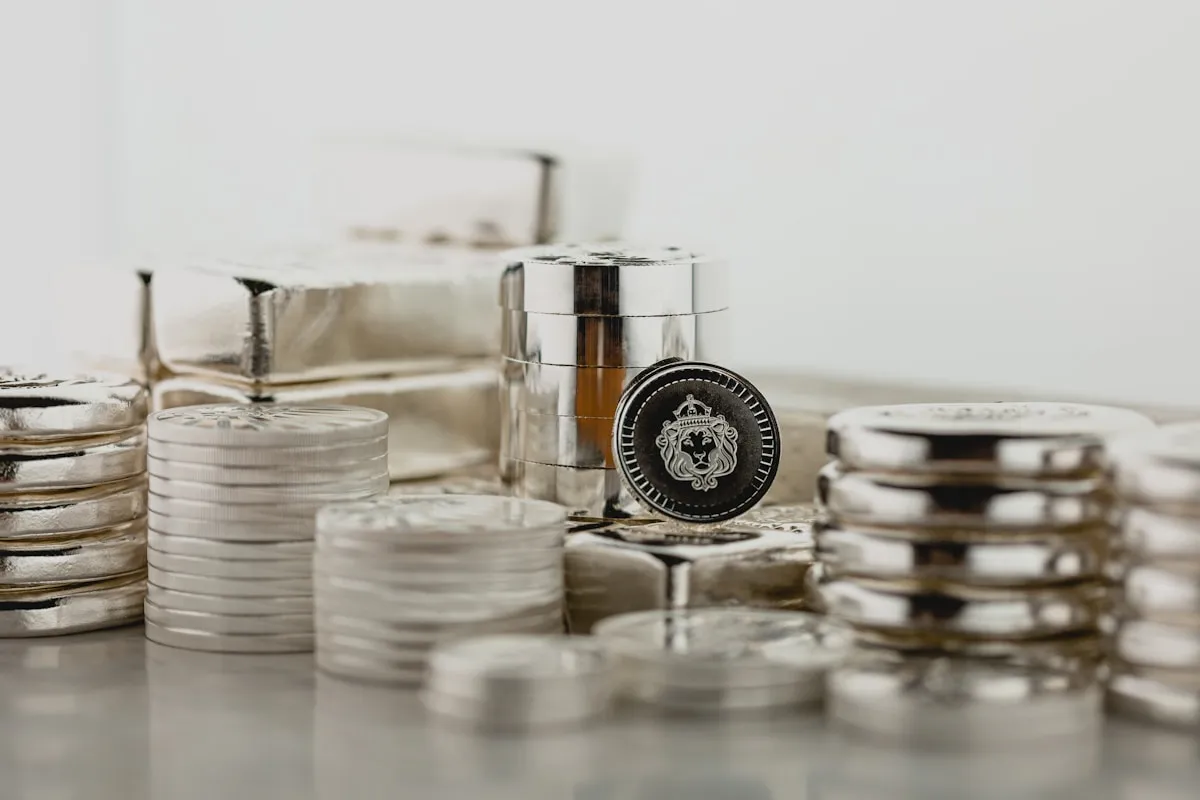 Stacked silver containers representing the premium layers that build on top of gold’s spot price