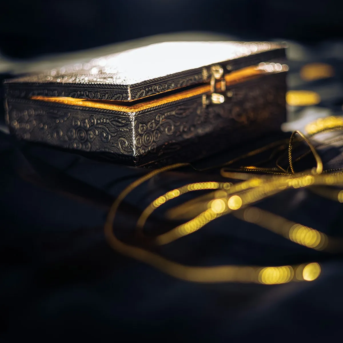 Elegant black box with gold trimmings symbolizing the containment and control of gold in monetary systems
