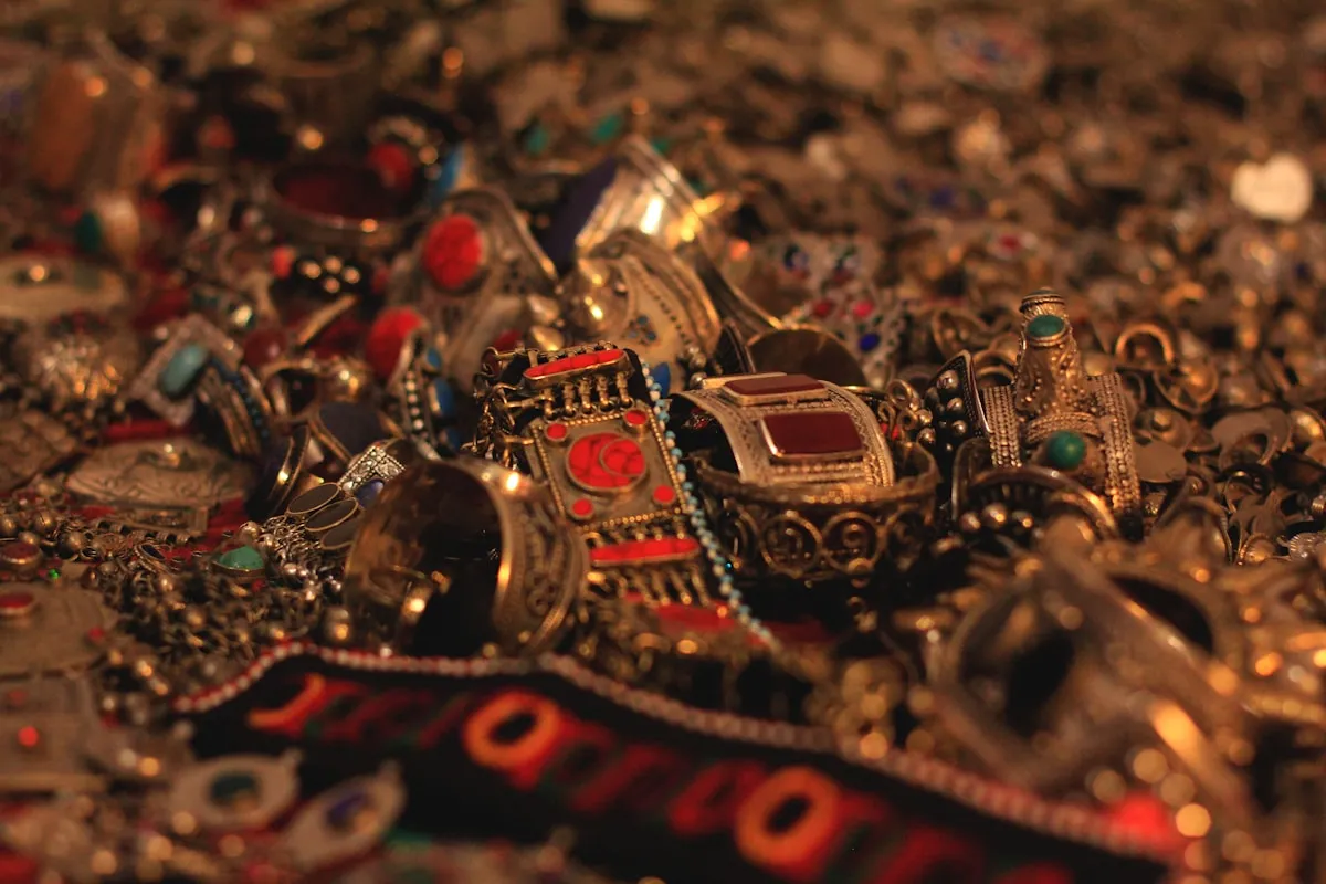 A pile of gold jewelry on a table, reminiscent of the treasure hoards that have captivated archaeologists and the public alike
