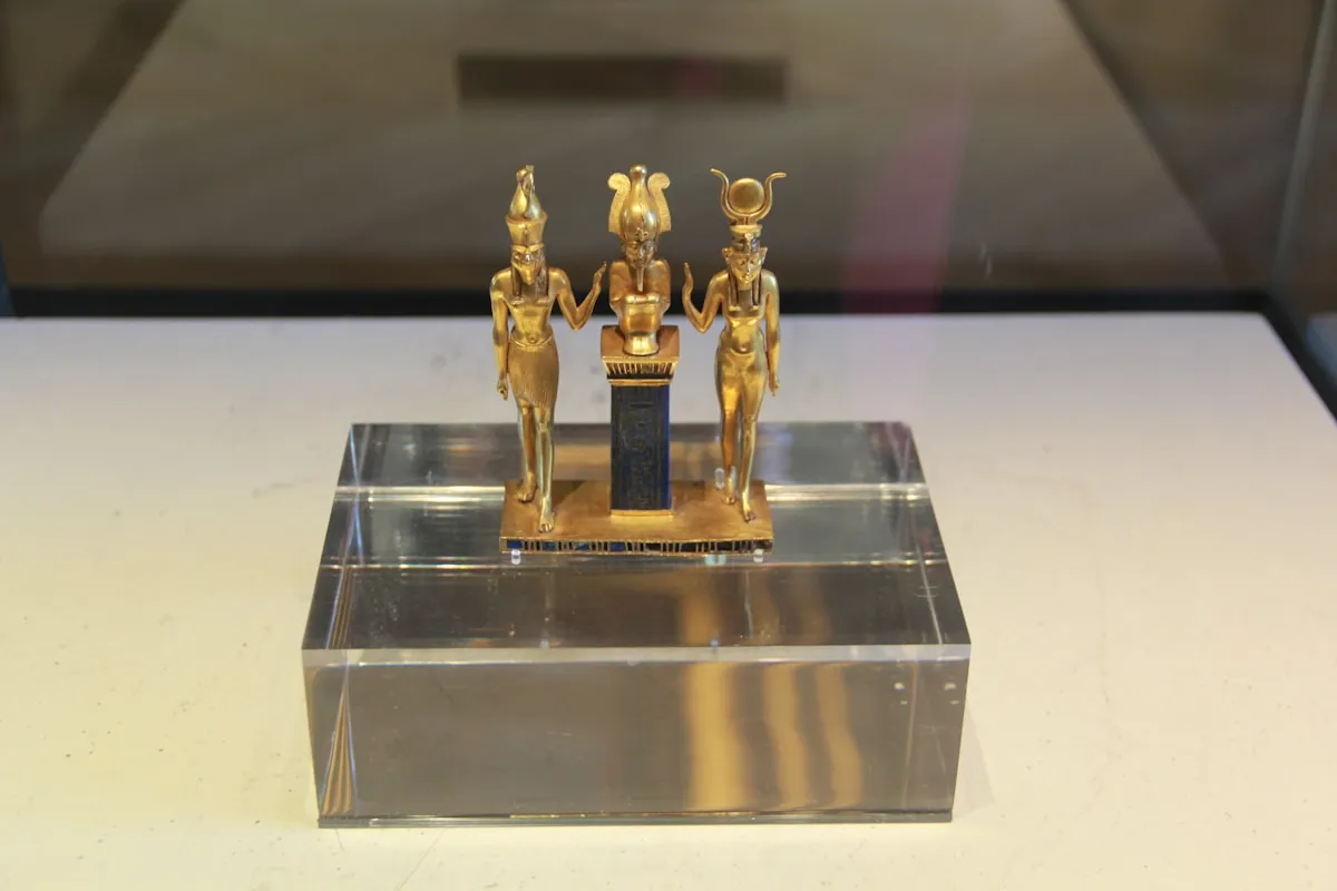 Golden Egyptian figurines representing the sacred role of gold in ancient civilizations