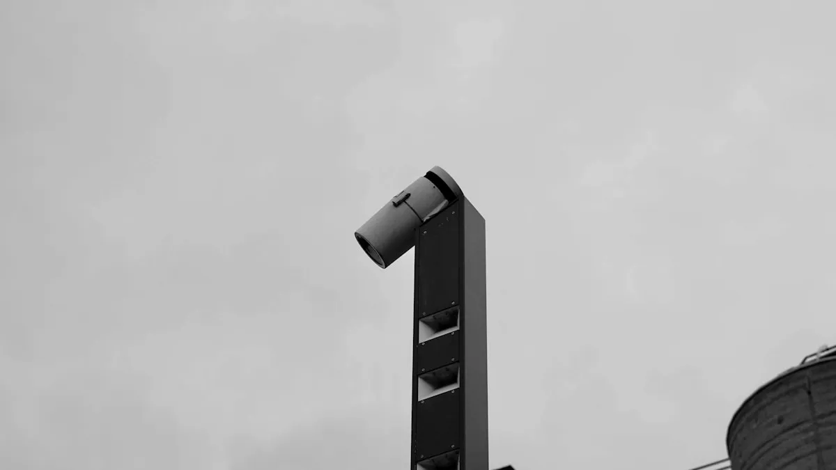 A tall siren pole against a gray sky, representing the alert systems and warning mechanisms that form part of a complete operational security posture